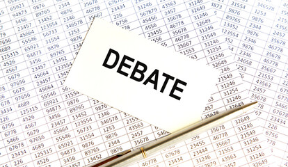 Obraz premium DEBATE is the inscription on the business card. Nearby pen, reports, books.