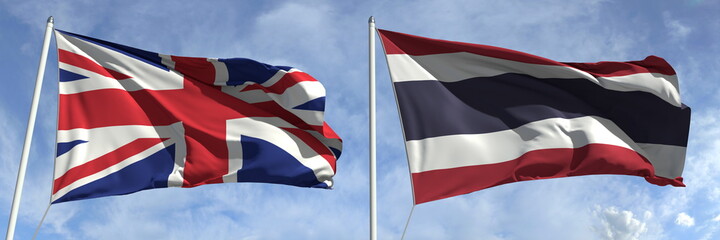 Waving flags of Great Britain and Thailand on flagpoles, 3d rendering