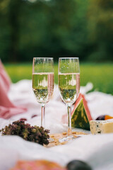 Two glasses with champagne. Bubbles are visible in the glasses.