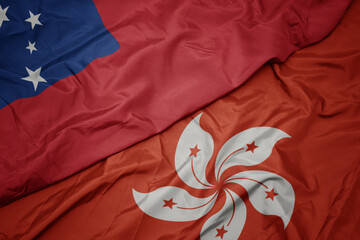 waving colorful flag of hong kong and national flag of Samoa .