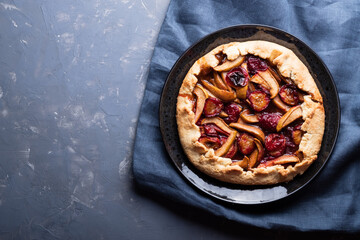 autumn galette with plums and pears. Open cottage cheese dough pie.