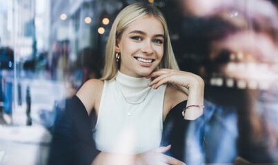 Happy young lady toothy smiling at camera