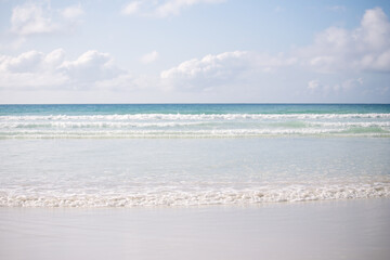 Fototapeta na wymiar Galapagos tropical white sand beach and turquoise ocean waves
