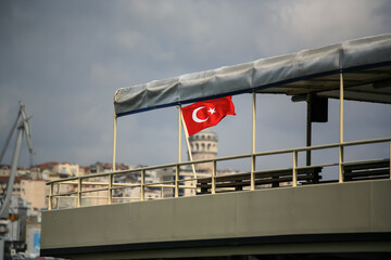 Turkish Flag on the steamer. Galata tower