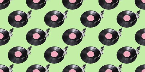 Seamless pattern. Abstract record player part isolated on green background. Disk Jockey turntable and vinyl. Retro music concept.
