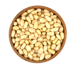 Bowl with pine nuts on white background