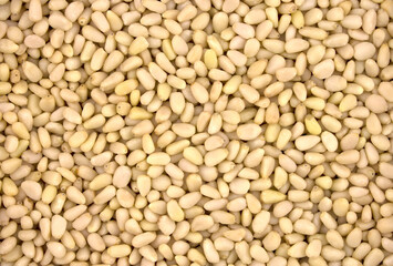 Background texture of shelled pine nuts.