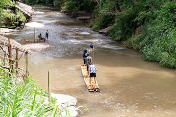 Chiangmai-Thailand, September 7,2020 People play bamboo raft in the local river.