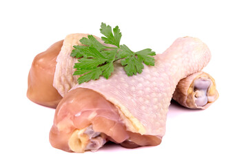 Raw chicken legs with parsley isolated on white background