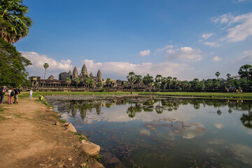 Fototapeta na wymiar Tourists taking a tour and photographing pictures of Angkor Wat, the world heritage site in Siem Reap, Cambodia. 