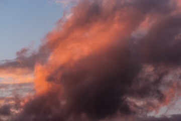 Fototapeta na wymiar Dark cloud lit by the sun.