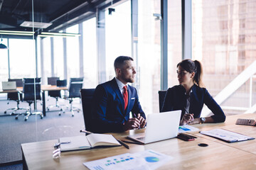 Brainstorming working process of male and female executive managers for discussing business details of cooperation, Caucasian colleagues talking about financial report research perspective strategy