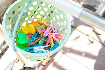 Plastic clothes pins in the bucket 