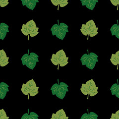 Seamless pattern of green leaves on a black background. Vector illustration. Great for use as an additional design. For decorating thematic banners, cards, prints, textiles, fabric, creatives ideas.