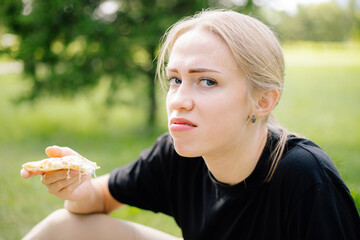 Bad taste of pizza, Beautiful girl don't like pizza expired spoiled food 