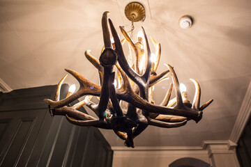 Old wooden chandelier on a pub in London.