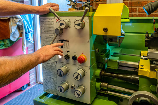 Engineer Tool Setter Checking The Required Spindle Speed For The Metal Work Lathe