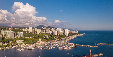 Aerial photography. The black sea coast of Russia, the city of Sochi, seaport, yachts and ships at the pier. City attraction