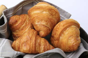 Fresh Croissant in a Brown Bucket