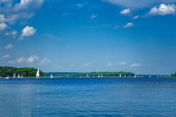 white boats sailing on the lake on a beautiful summer day (HDRi)