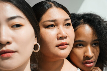 Face portraits with women of different ethnicities.
