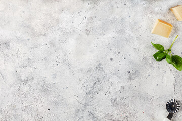 Top view of a light gray concrete table with cheese