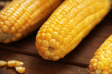 Corn. Yellow corn close up. Corn on wooden background