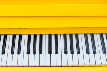 Panel with yellow piano keys with top view