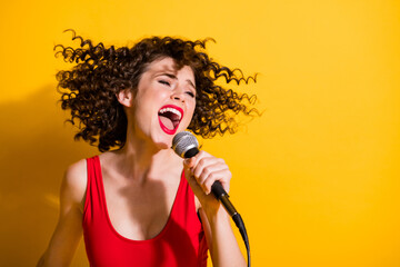 Closeup headshot photo of pretty gorgeous young girl hand hold mic open mouth sing romance song...