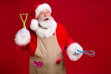 Photo of crazy modern style chef santa claus hold kitchenware x-mas dinner cook wear red costume...
