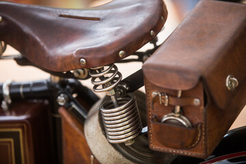 Vintage motorcycle leather saddle and toolbox