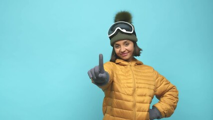 Young snowboard indian woman showing number one with finger