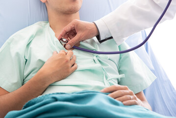 Midsection Of Doctor Examining Patient At Hospital