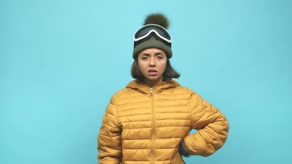 Young snowboard indian woman showing a disappointment gesture with forefinger