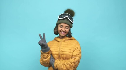 Young snowboard indian woman showing number two with fingers
