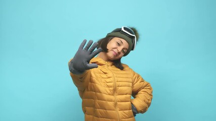 Young snowboard indian woman smiling cheerful showing number five with fingers