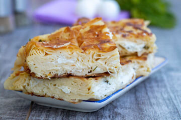 Su Boregi / Turkish Patty on wooden surface.