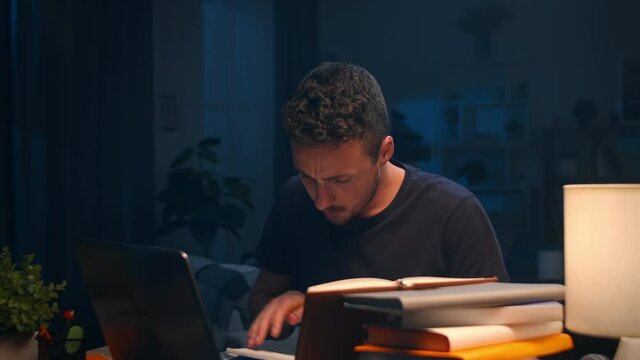 Young man studying late at night