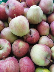 A few apples placed on a place