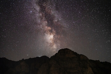 Beautiful night landscape,  huge cliff,  starry sky with bright milky way galaxy. Night landscape. Astronomical background.