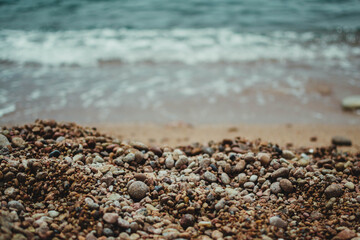 Stones from the shore of the beach near the water
