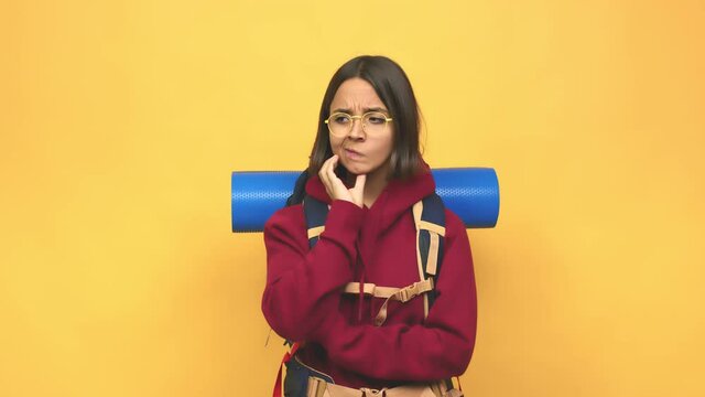 Young hiker indian woman confused, feels doubtful and unsure
