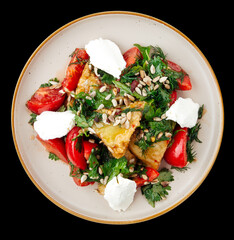 Hearty salad with vegetables isolated on the black