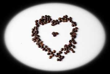 Grains of coffee on a white background. Different shapes made from grains