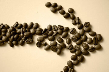 Grains of coffee on a white background. Different shapes made from grains