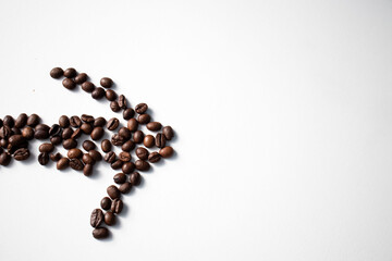 Grains of coffee on a white background. Different shapes made from grains