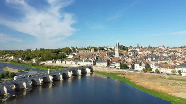 The dunes in front of the city center of Charite sur Loire in Europe, France, Burgundy, Nievre, in summer, on a sunny day.