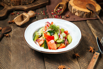 Fresh vegetables salad with tomatoes and cucumbers