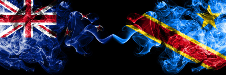 New Zealand vs Democratic Republic of the Congo smoky mystic flags placed side by side. Thick colored silky abstract smoke flags