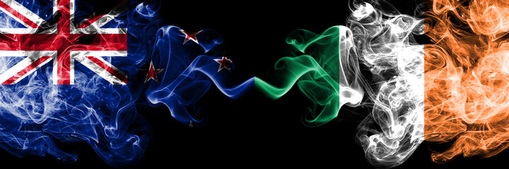 New Zealand vs Ireland, Irish smoky mystic flags placed side by side. Thick colored silky abstract smoke flags